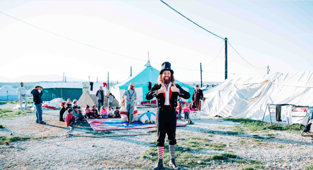 refugee camps kids europe clowns