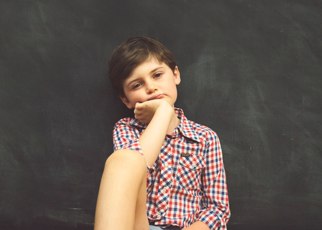 boredom is good for kids, a photo of a bored looking white boy, for lunch lady magazine