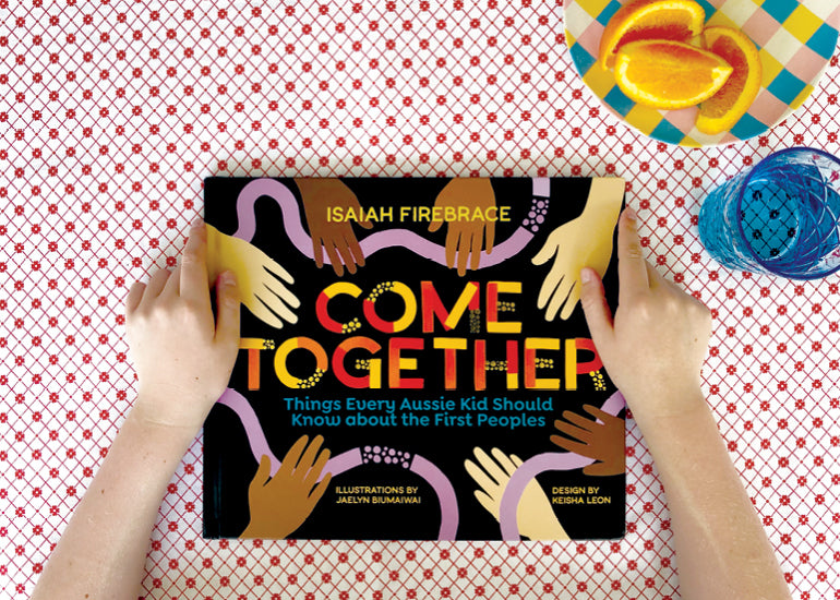 come together book cover by isaiah firebrace placed on a tablecloth