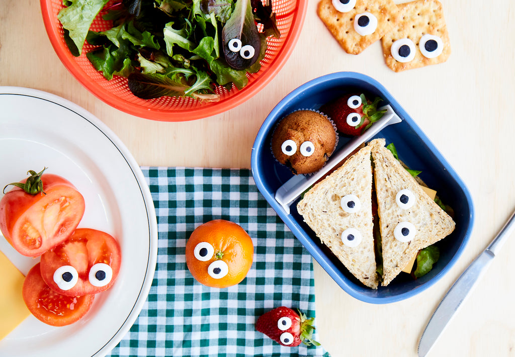 edible eyes made from royal icing stuck on sandwiches, fruit and veg for Lunch Lady Magazine