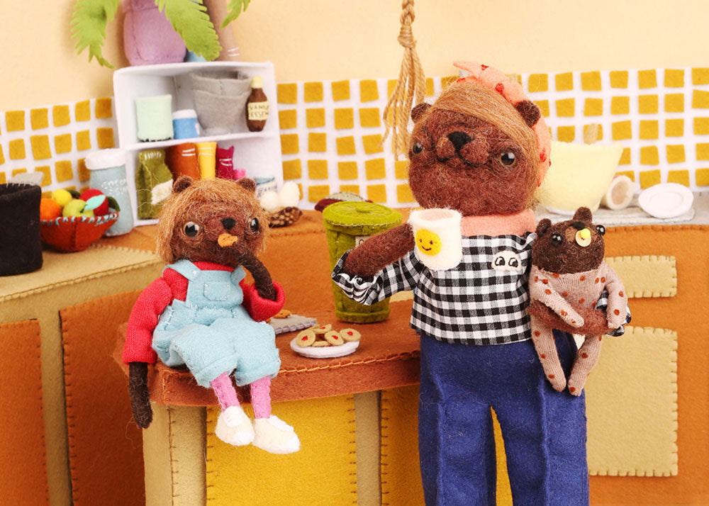 wombats made from textiles are in a kitchen drinking tea and eating biscuits by Cat Rabbit