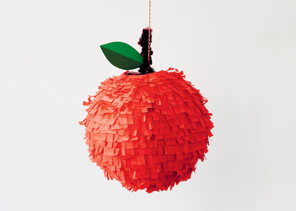 photo of a homemade red apple piñata by beci orpin for lunch lady magazine