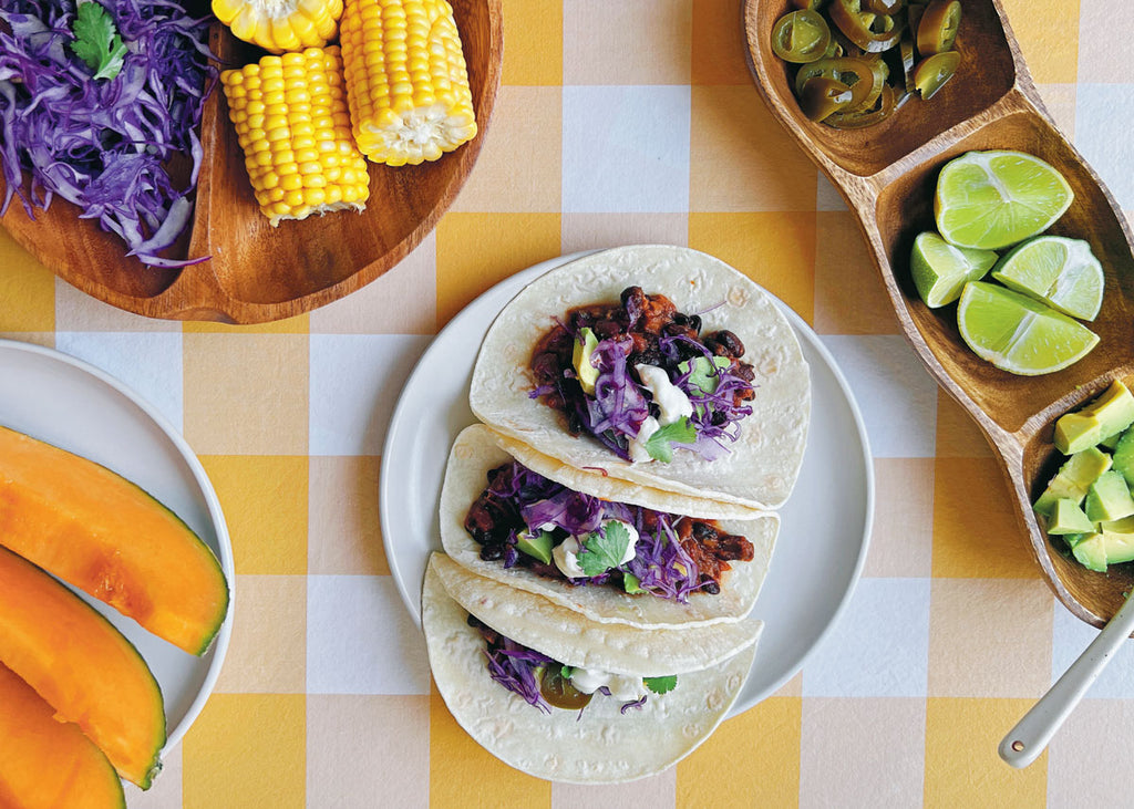Overhead photo of black bean tacos on a plate for Lunch Lady Magazine