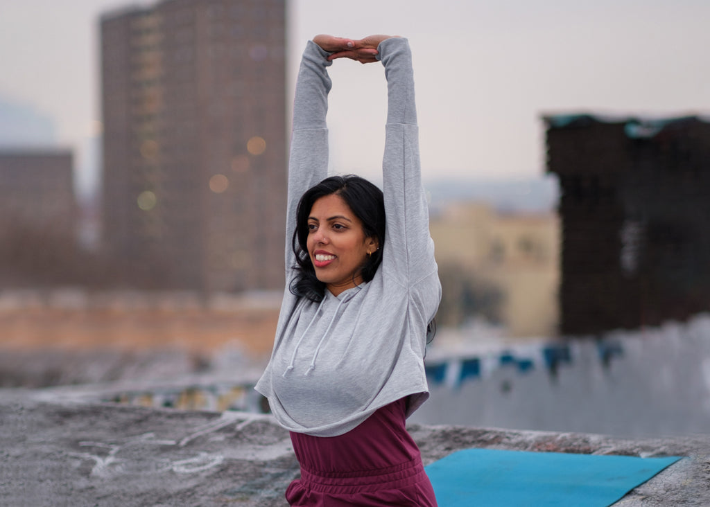 portrait of tejal patel doing yoga stretches for lunch lady magazine