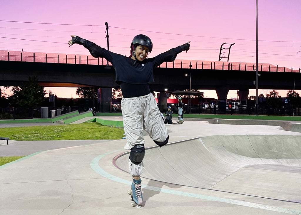 Photo of Zulfiye Tufa rollerskating at a skatepark at sunset for Lunch Lady Magazine Parents who Play feature
